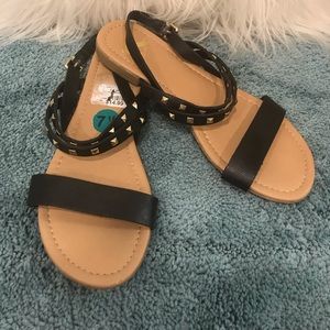 Report Black and gold stud sandals